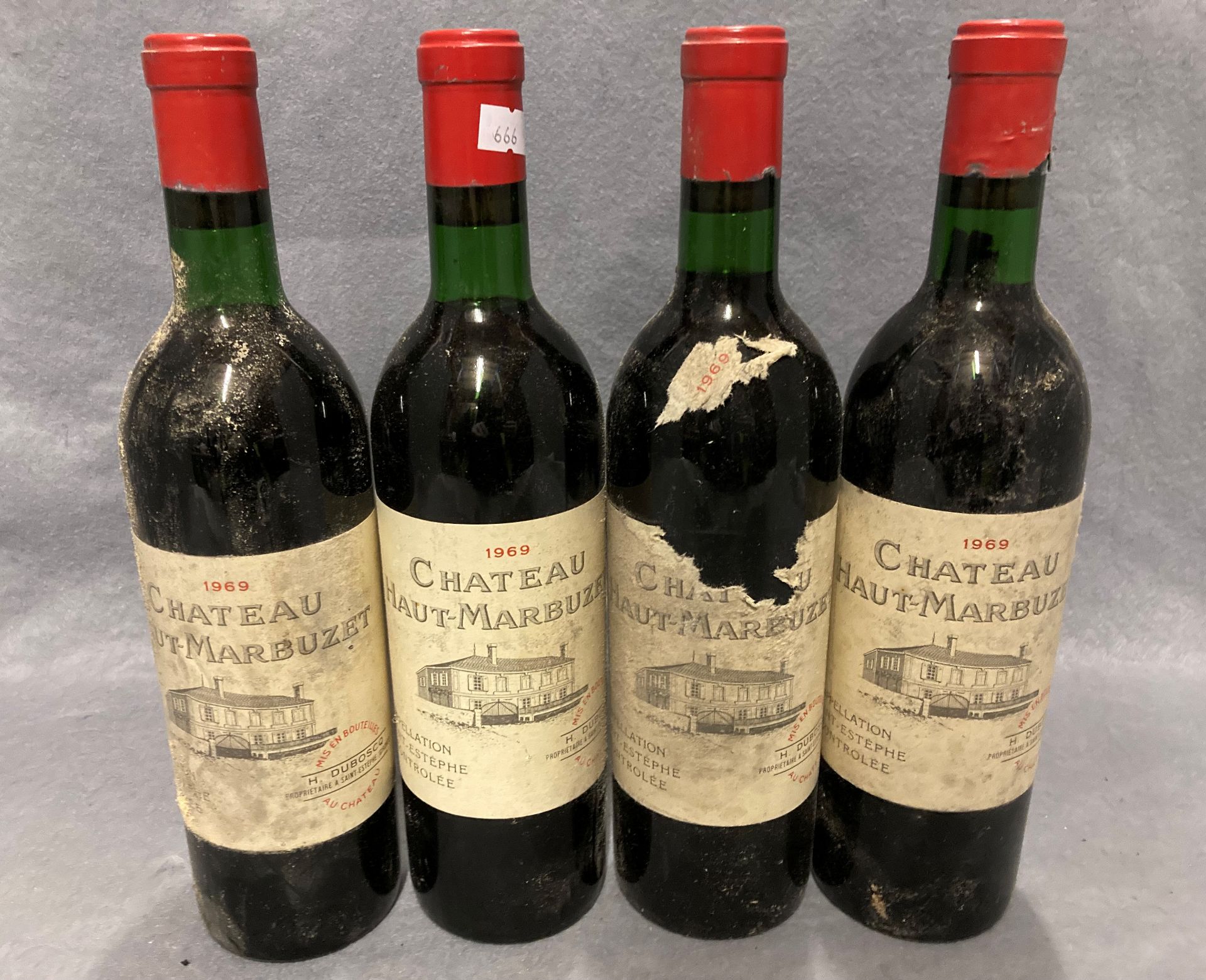 Four 75cl bottles of H Duboscq Chateau Haut-Marbuzet 1969 red wine - advised stored cellared