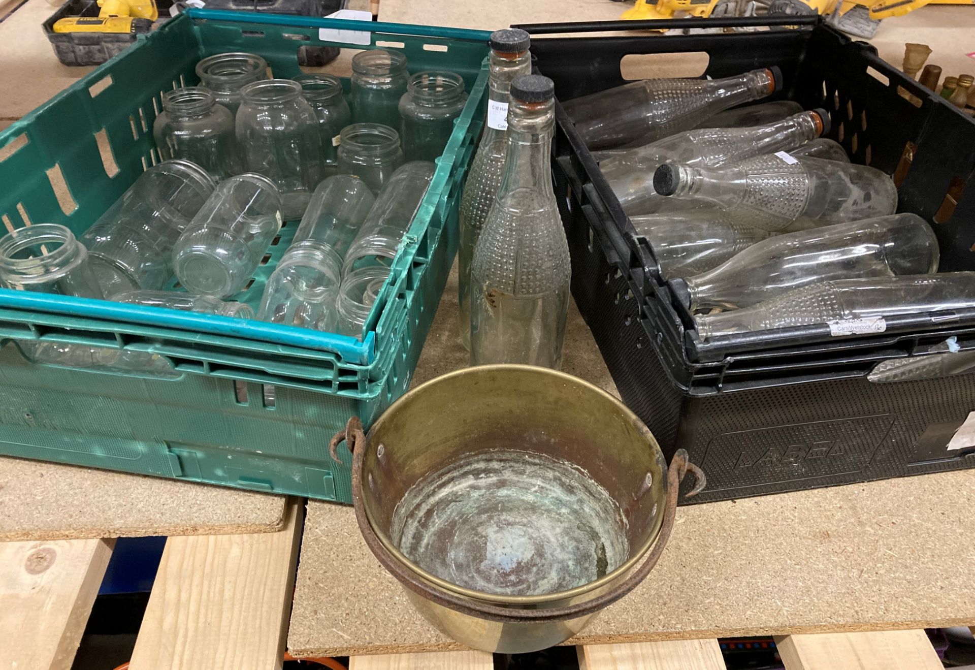 Contents to two trays (trays property of CW Harrison) approximately 14 empty Lucozade bottles,