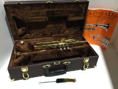 Elkhart Series 2 Trumpet in brown carrying case with cleaning brush and book 1 - A Tune A Day