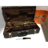 Elkhart Series 2 Trumpet in brown carrying case with cleaning brush and book 1 - A Tune A Day