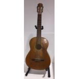 Six string Acoustic Guitar with wear to face,