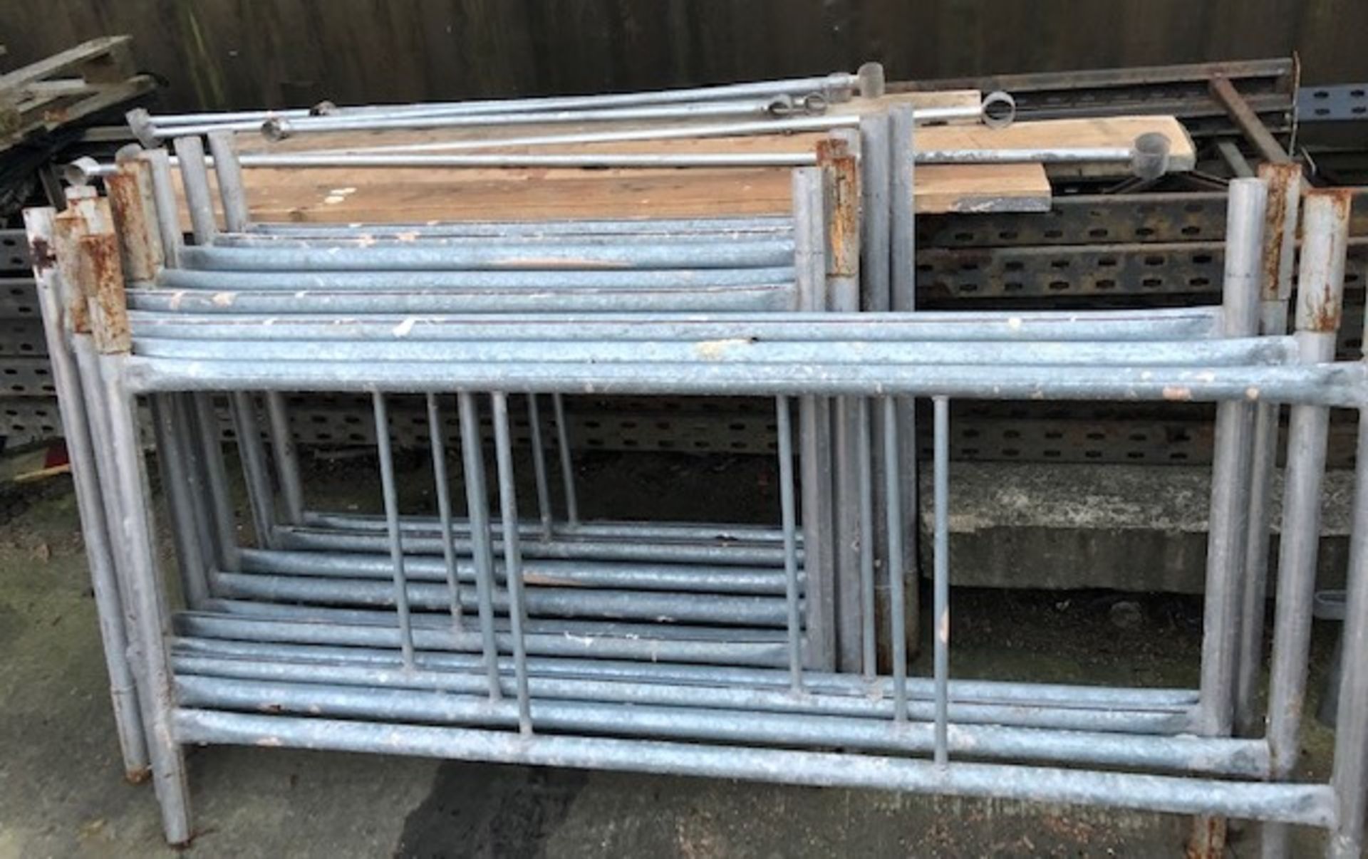 A galvanised scaffold tower with four sections, 180cm x 104cm, six sections 120cm x 104cm,