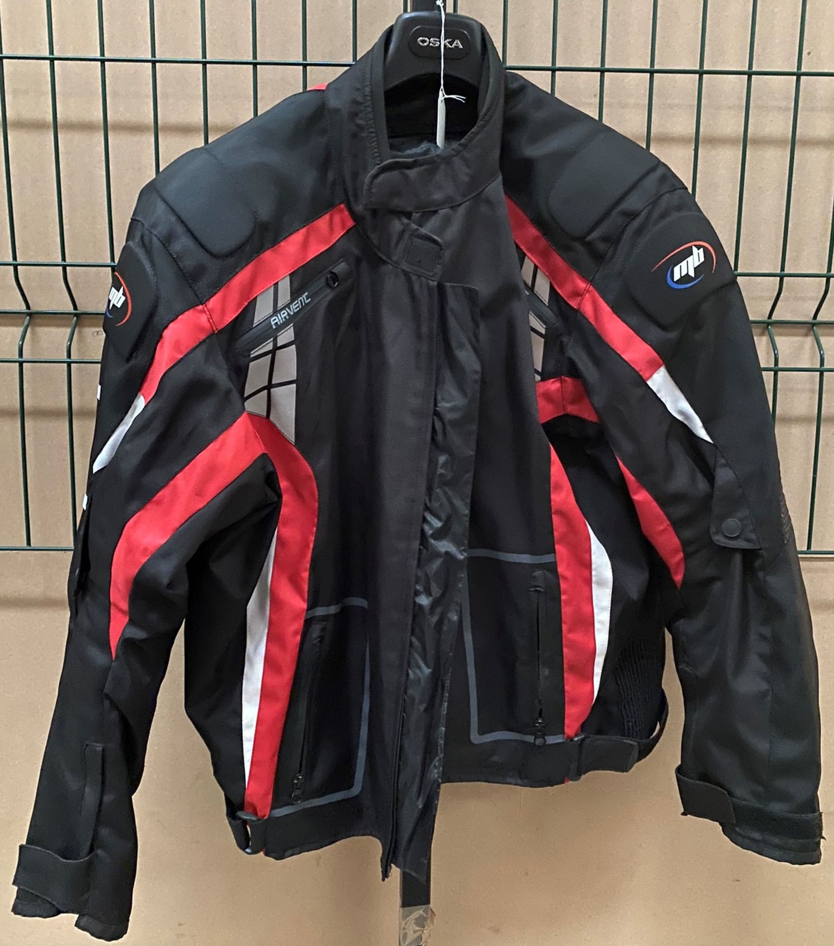 An M8 Airvent black and red padded motor cycle jacket, size L - looks hardly used.