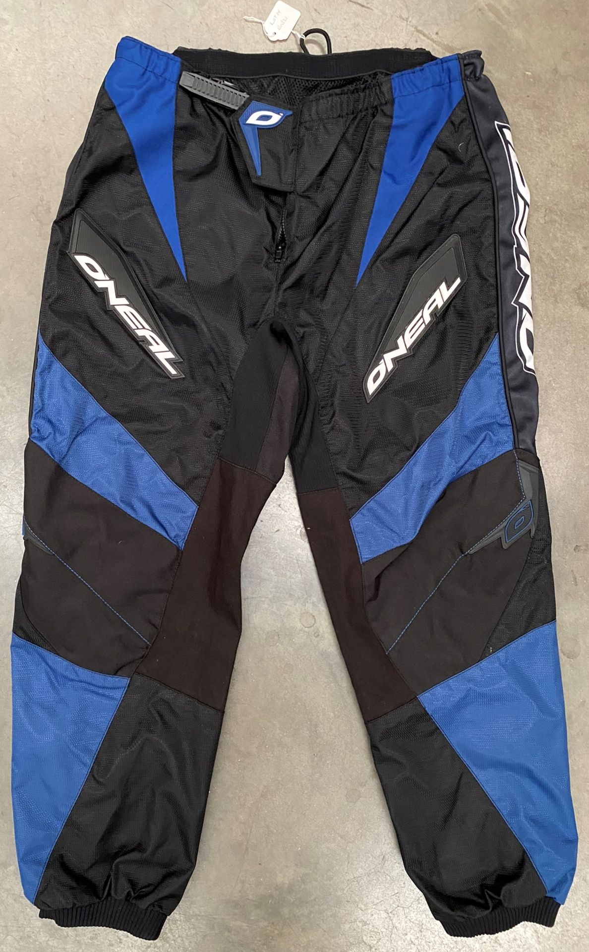 An O'Neal Raving Elements pair of blue and black waterproof coated 100% polyester motorbike