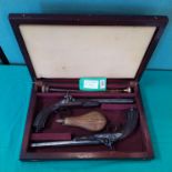 A pair of French percussion rifled target pistols,
