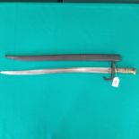 A French model 1866 brass hilted sabre bayonet (dated 1868) with matching numbered scabbard