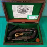 A pair of percussion rifled target pistols, each overall 12" with 6 1/4" barrels of approx 27 bore,