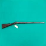 A percussion (conversion from Flintlock) shotgun with 32 1/2" barrel of approx 16 bore,