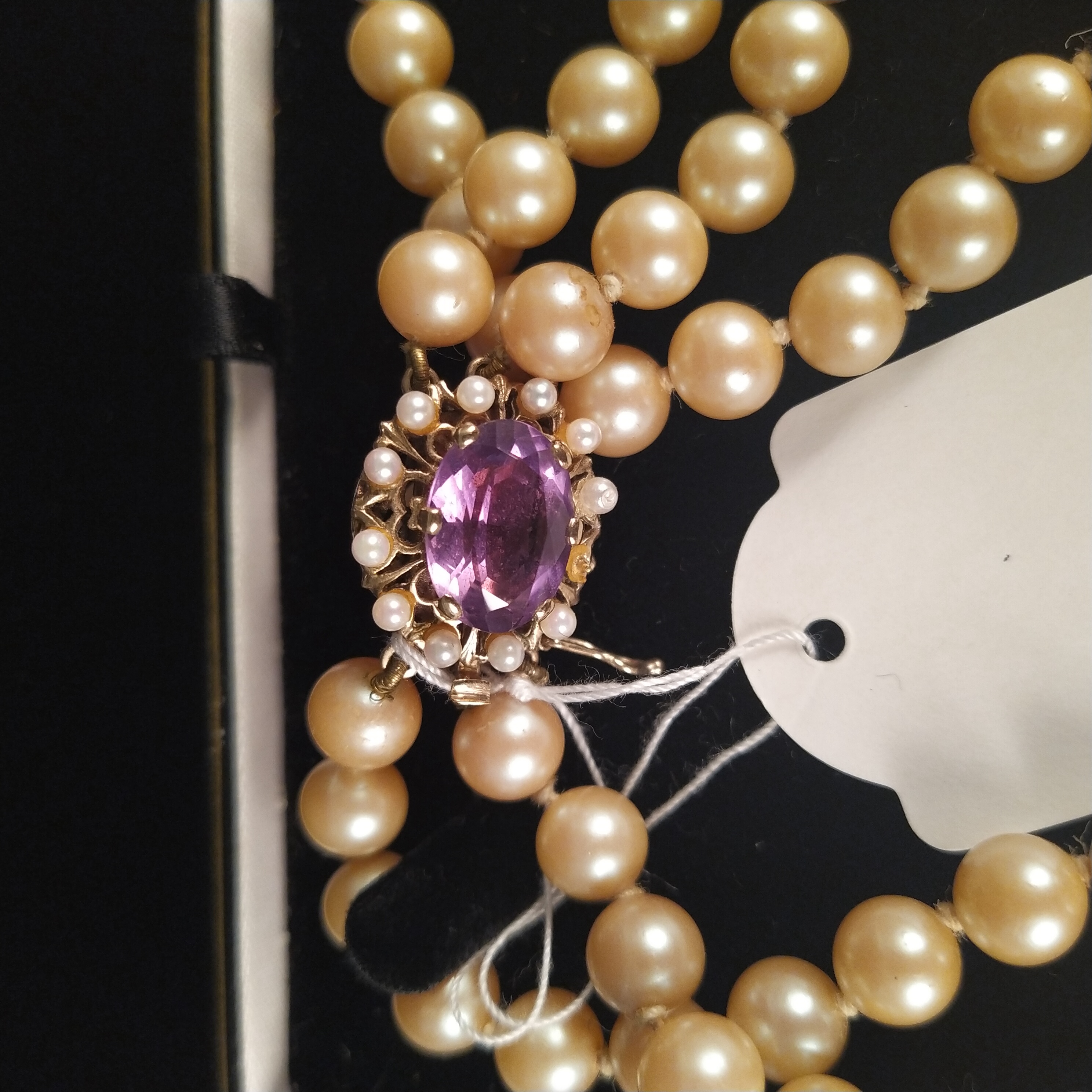 A triple strand simulated pearl necklace set with large 9ct gold amethyst and seed pearl clasp (one - Image 2 of 3