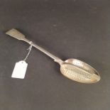 A Victorian silver straining spoon, hallmarked London 1853 by George Adams,