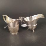 Two silver cream jugs, one of half fluted detail, Birmingham 1883,