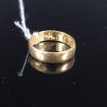A 22ct gold wedding band (slightly misshapen), size approx M,