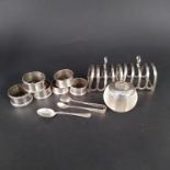 A mixed lot of silver items including a pair of toast racks and six various napkin rings