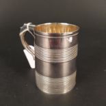 A Georgian silver tankard with ribbed details, hallmarked London 1813, makers mark rubbed,