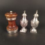 A pair of silver pepperettes with weighted bases, hallmarked Birmingham 1896, makers mark T H,
