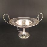 A silver twin handled tazza on pedestal base with pierced design, hallmarked London 1907,