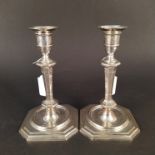 A pair of Edwardian silver candlesticks, hallmarked Sheffield 1906 by James Dixon & Son,