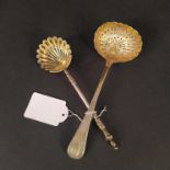 Two silver gilt sifter spoons,