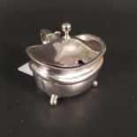 A Georgian silver mustard pot with ribbed edge detail on four bun feet (possible replacement liner