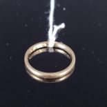 An 18ct gold wedding band (heavily worn), size L, approx 1.