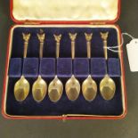 A boxed set of six silver gilt fox head terminal teaspoons, hallmarked Birmingham 1948,