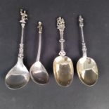 Four various white metal and silver apostle type spoons
