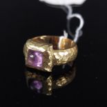 An abstract 18ct gold amethyst set ring with planished design square setting, size P,