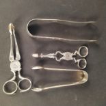 Two pairs of silver sugar nips (one repaired) plus two pairs of sugar tongs (one repaired)