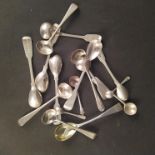 A large quantity of silver condiment spoons with various makers and dates