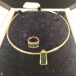 An 18ct gold collerette style necklace with small diamond set clasp and 18ct gold green stone set