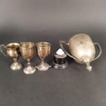 A twin handled silver trophy cup (as found), two smaller trophies (as found) plus an egg cup,