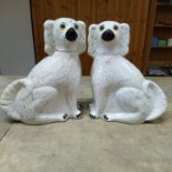 A pair of Staffordshire dogs with glass eyes