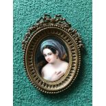 A fine 19th Century hand painted on porcelain picture miniature in gilt metal oval frame