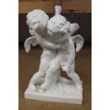 A continental white finish porcelain figure group of two cherubs fighting,