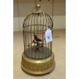 A 19th Century style bird in cage automation,