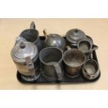 Two Victorian pewter tankards, a three piece pewter tea set,