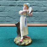 A Royal Worcester tambourine player marked 1032 to base,