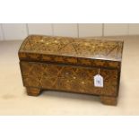 A large marquetry inlaid domed top casket,