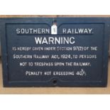 A vintage cast metal warning sign for The Southern Railway,