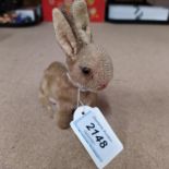 A small vintage Steiff mohair rabbit with button to ear and glass eyes,