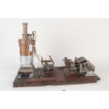 An early 20th Century hand built twin cylinder horizontal steam engine with vertical fire tube