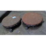 A pair of 19th Century low round wooden foot stools with lion paw feel (wear to paint)