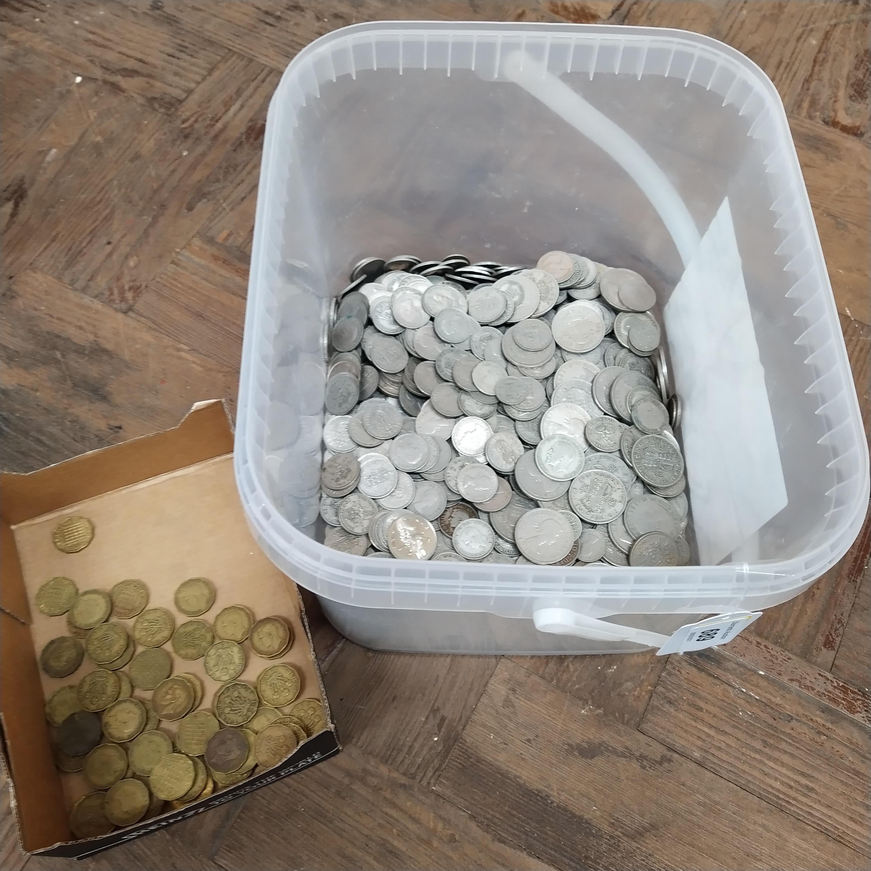 A tub of 20th Century silver coins all post WWII together with a selection of threepenny bits