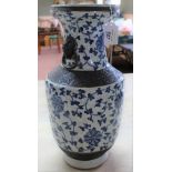 A large Chinese heavily crazed blue and white vase with fixed ring handles,