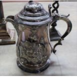 A 17th Century style lidded silver plated jug with mask spout,