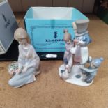 Two boxed Lladro figurines, Snowman with Children 05713,