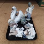 A Lladro swan dated 1983 plus a girl with basket, Christmas tree, duck with chicks,