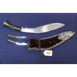 A highly ornate kukri (possible presentation) with high relief white metal decoration and horn grip
