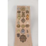 A card of twenty various badges and insignia,