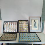 Four framed displays of military themed cigarette cards,